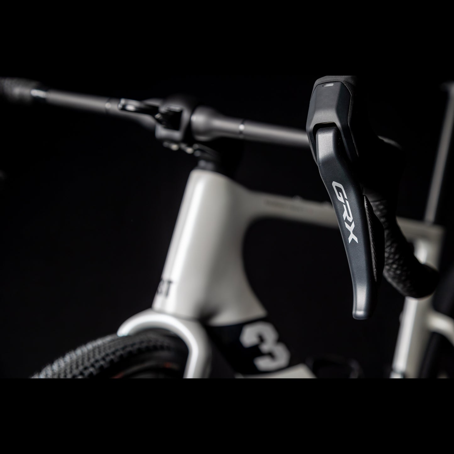 3T Racemax Italia size 54 in Pearl White, equipped with 50mm DT Swiss GRC 1400 wheels and Shimano GRX Di2 12-speed electronic drivetrain, photographed against a sleek black background.