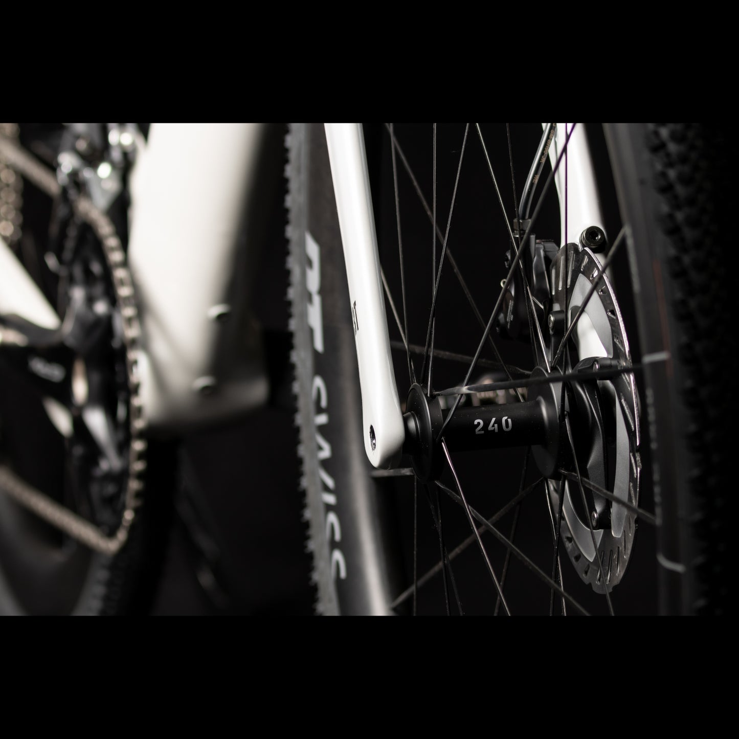 3T Racemax Italia size 54 in Pearl White, equipped with 50mm DT Swiss GRC 1400 wheels and Shimano GRX Di2 12-speed electronic drivetrain, photographed against a sleek black background.