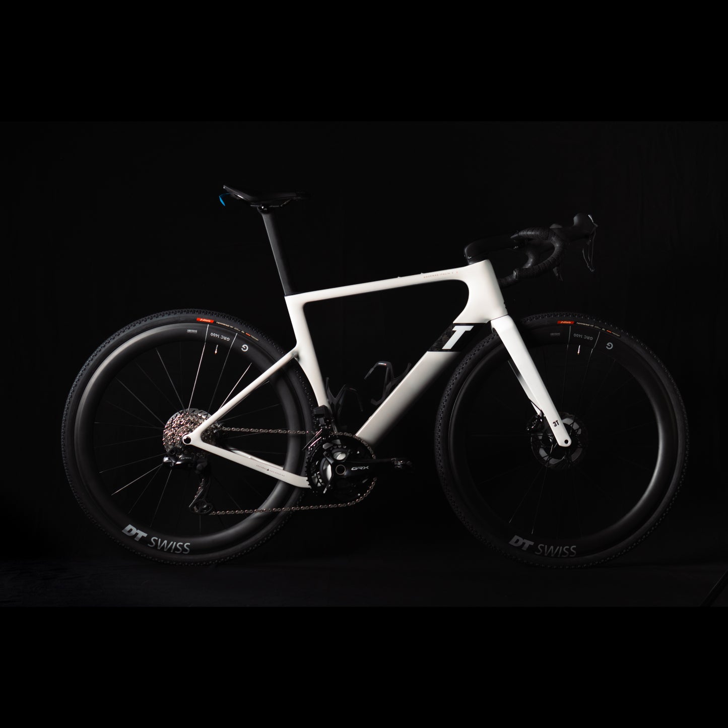 3T Racemax Italia size 54 in Pearl White, equipped with 50mm DT Swiss GRC 1400 wheels and Shimano GRX Di2 12-speed electronic drivetrain, photographed against a sleek black background.