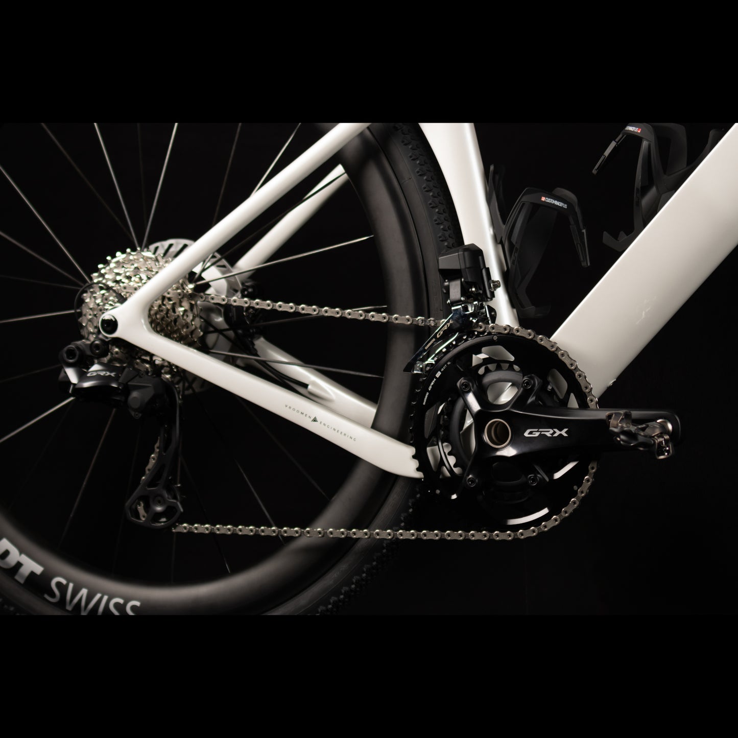 3T Racemax Italia size 54 in Pearl White, equipped with 50mm DT Swiss GRC 1400 wheels and Shimano GRX Di2 12-speed electronic drivetrain, photographed against a sleek black background.