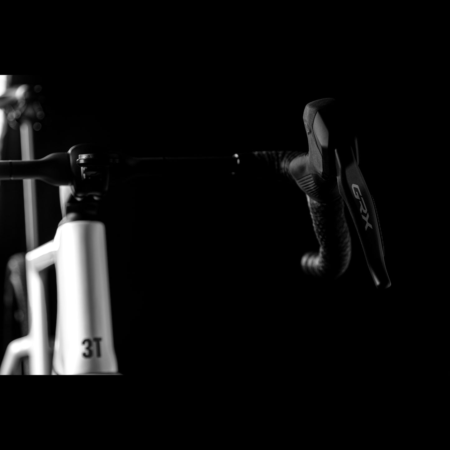 3T Racemax Italia size 54 in Pearl White, equipped with 50mm DT Swiss GRC 1400 wheels and Shimano GRX Di2 12-speed electronic drivetrain, photographed against a sleek black background.
