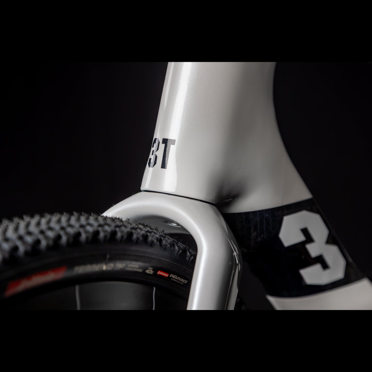 3T Racemax Italia size 54 in Pearl White, equipped with 50mm DT Swiss GRC 1400 wheels and Shimano GRX Di2 12-speed electronic drivetrain, photographed against a sleek black background.
