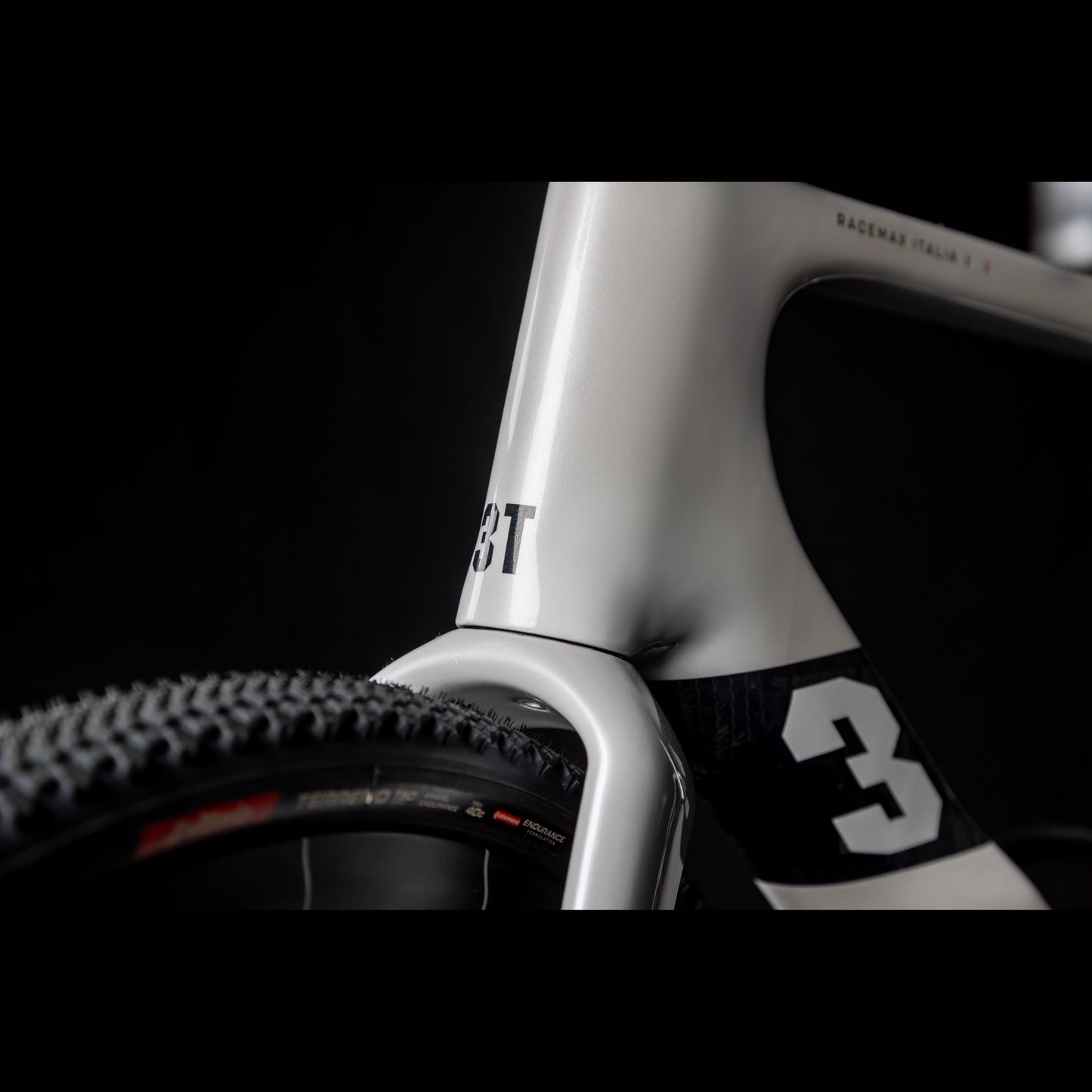 3T Racemax Italia size 54 in Pearl White, equipped with 50mm DT Swiss GRC 1400 wheels and Shimano GRX Di2 12-speed electronic drivetrain, photographed against a sleek black background.