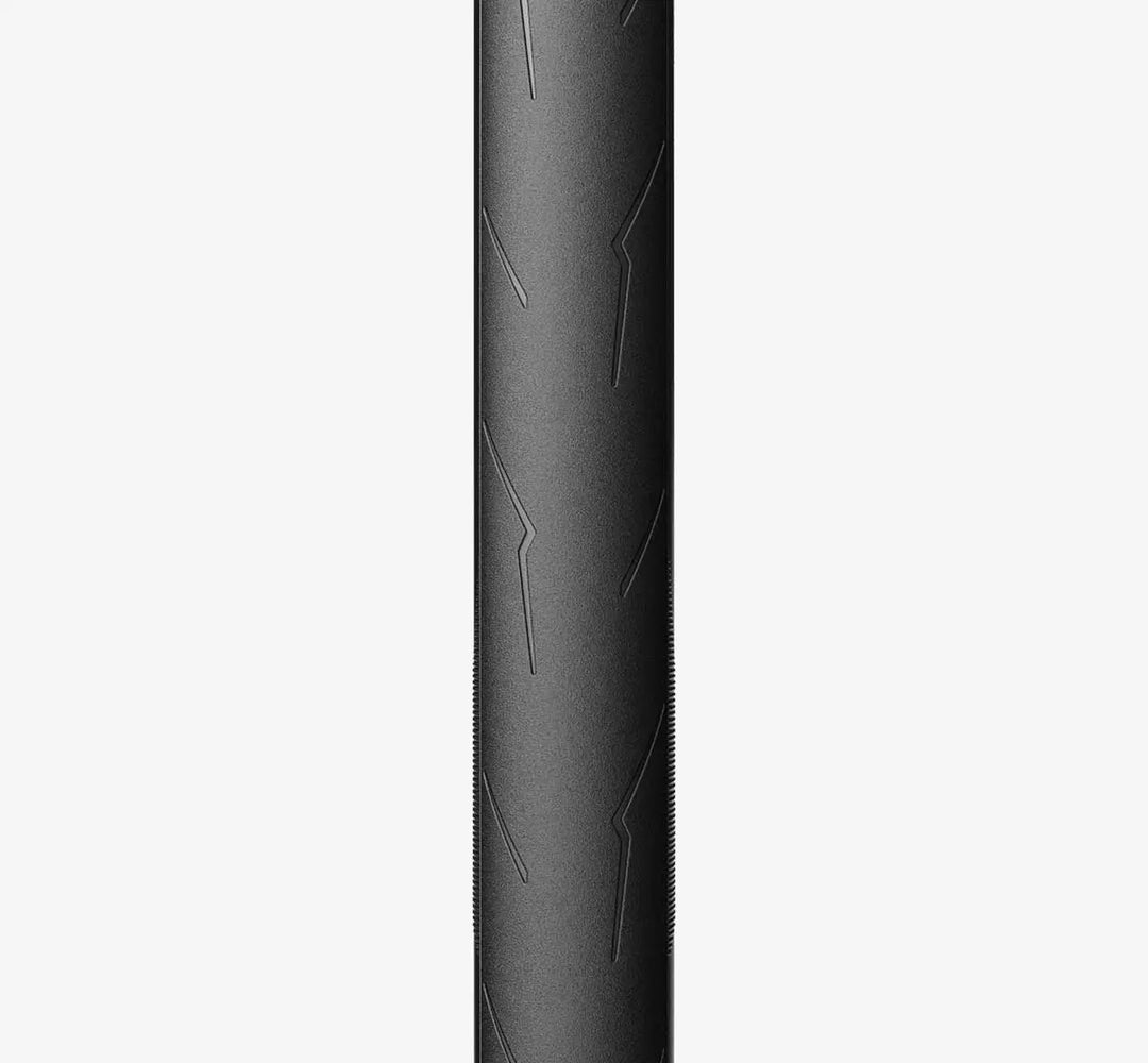 Close-up front of a Black Pirelli PZero Race tire with detailed tread pattern on a white background - Dragonspine Cycling