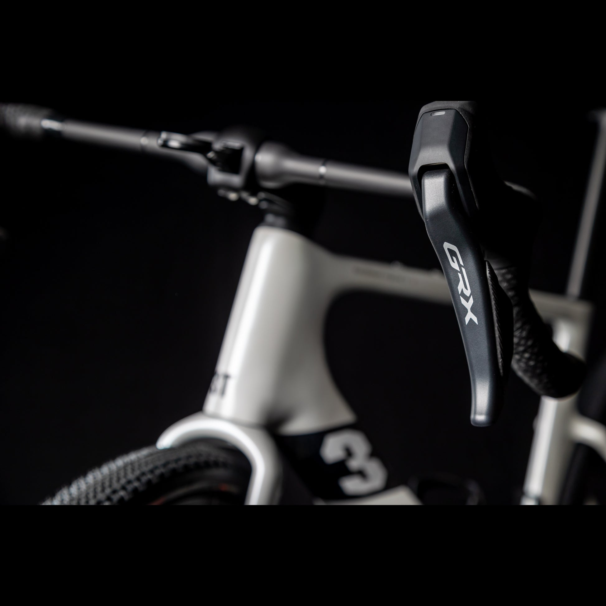 3T Racemax Italia size 54 in Pearl White, equipped with 50mm DT Swiss GRC 1400 wheels and Shimano GRX Di2 12-speed electronic drivetrain, photographed against a sleek black background.