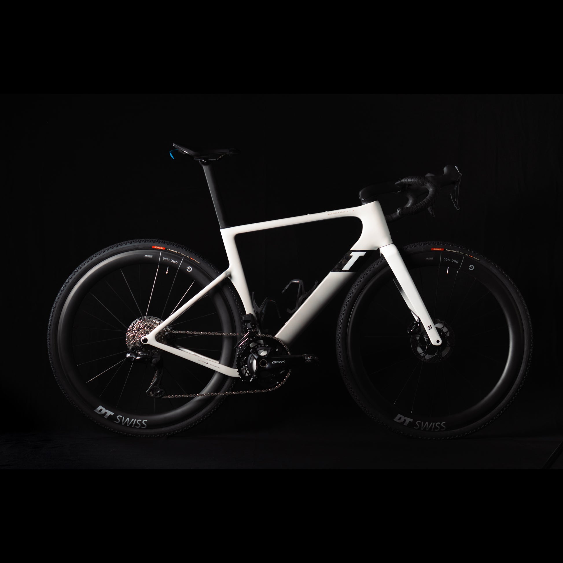 3T Racemax Italia size 54 in Pearl White, equipped with 50mm DT Swiss GRC 1400 wheels and Shimano GRX Di2 12-speed electronic drivetrain, photographed against a sleek black background.