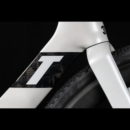 3T Racemax Italia size 54 in Pearl White, equipped with 50mm DT Swiss GRC 1400 wheels and Shimano GRX Di2 12-speed electronic drivetrain, photographed against a sleek black background.