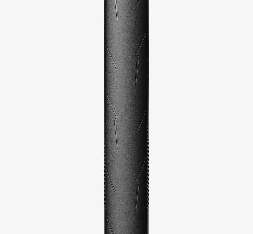 Close-up front of a Black Pirelli PZero Race tire with detailed tread pattern on a white background - Dragonspine Cycling