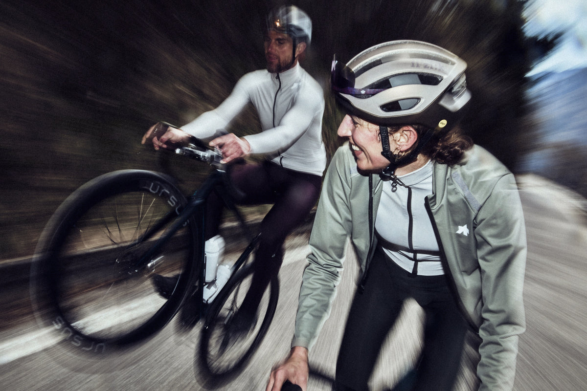 Two riders in Assos winter kit on a fast descent