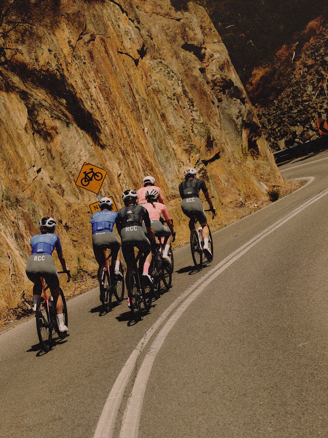 RCC riders in Rapha kit on a mountain road